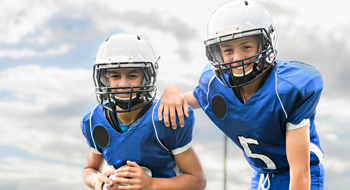 two youth football players